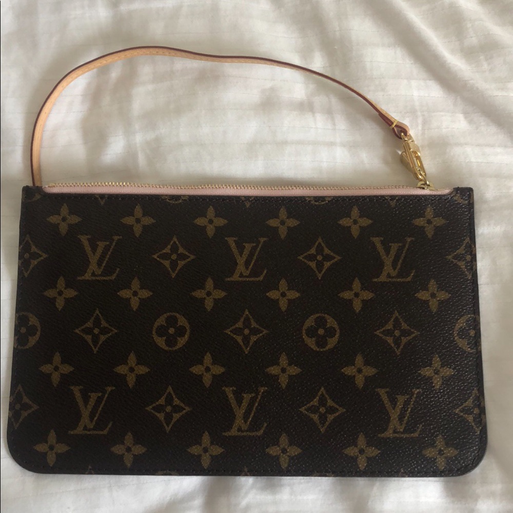 Gently used Louis Vuitton Wristlet - No odors, stains or other blemishes.